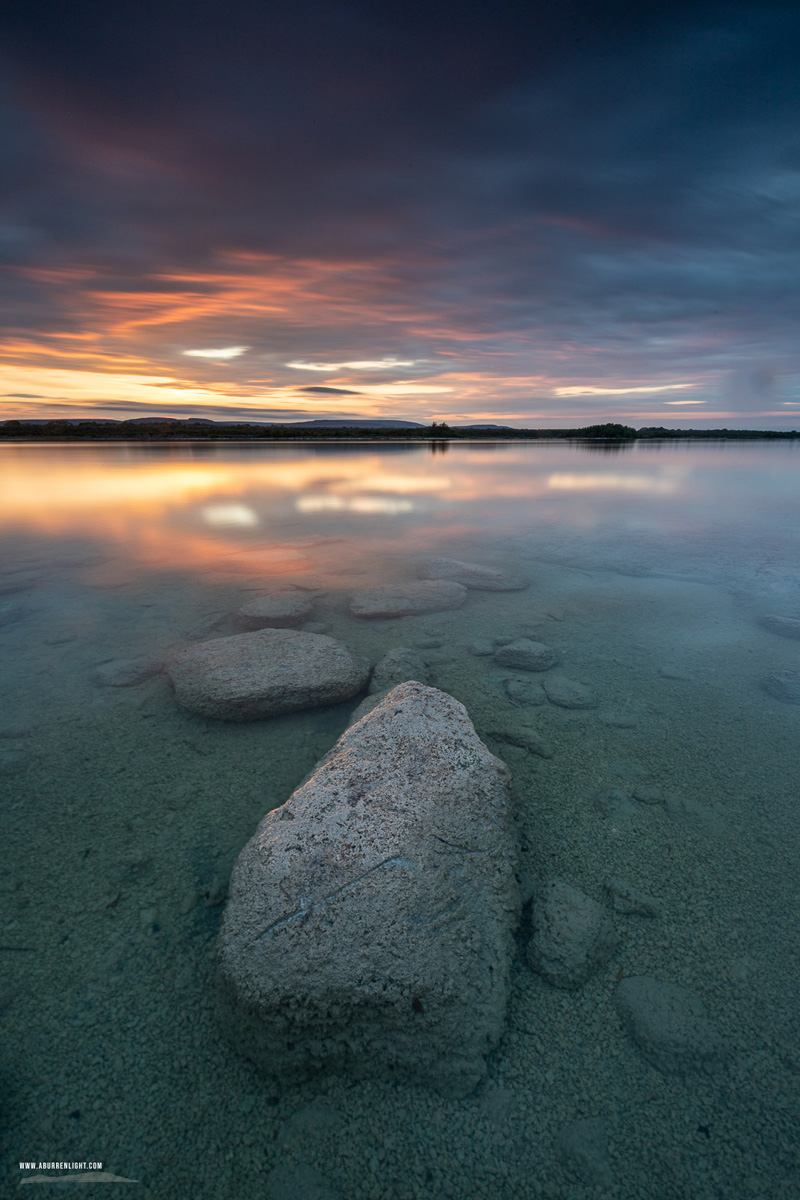 Colourful dusk sky reflected at Lough Bunny